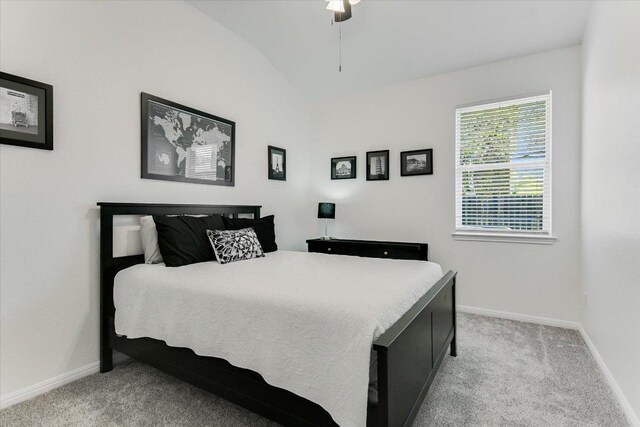 240 Fort Mabry Loop, Georgetown, TX 78628 - bedroom featuring baseboards, vaulted ceiling, and light carpet