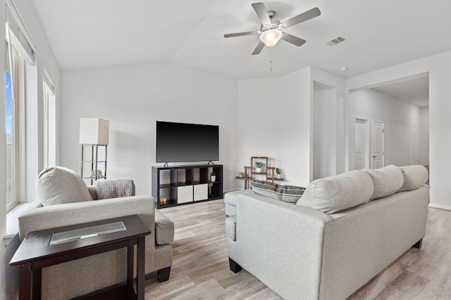 216 Pearland St, Hutto, TX 78634 - living room with ceiling fan, visible vents, vaulted ceiling, and light wood finished floors