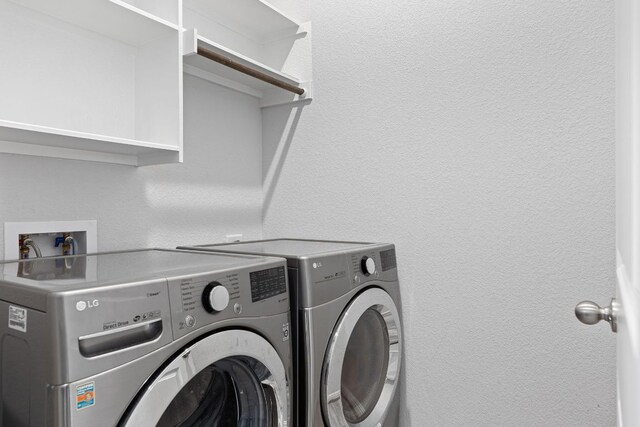 216 Pearland St, Hutto, TX 78634 - clothes washing area featuring laundry area and washer and clothes dryer