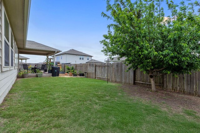 216 Pearland St, Hutto, TX 78634 - view of yard featuring a fenced backyard