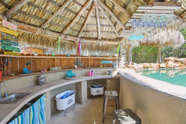 view of patio / terrace with a sink, a gazebo, and exterior kitchen