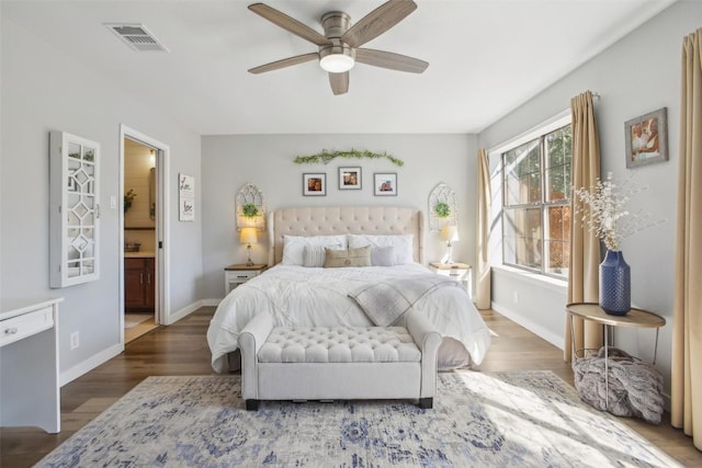 2858 Cedar Hollow Rd, Georgetown, TX 78628 - bedroom featuring wood finished floors, ensuite bath, and ceiling fan