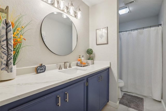full bathroom featuring visible vents, curtained shower, vanity, tile patterned floors, and toilet