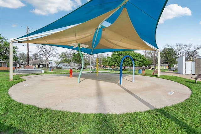 community playground featuring a lawn