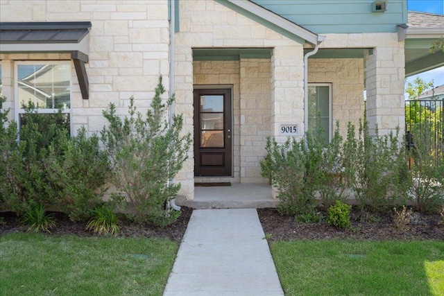 9015 Looksee Ln, Austin, TX 78744 - entrance to property featuring a lawn and stone siding