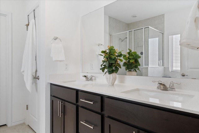 9015 Looksee Ln, Austin, TX 78744 - full bath featuring a shower stall and double vanity