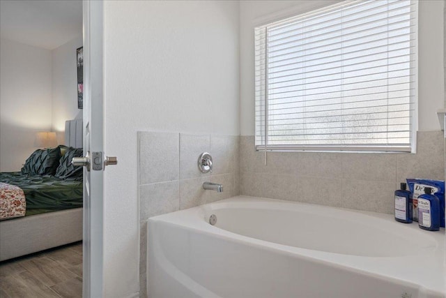 9015 Looksee Ln, Austin, TX 78744 - full bathroom with plenty of natural light, a garden tub, and ensuite bath
