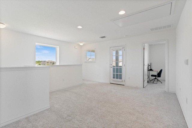 9015 Looksee Ln, Austin, TX 78744 - spare room featuring attic access, carpet flooring, an office area, recessed lighting, and baseboards