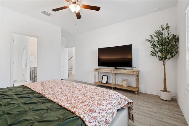 9015 Looksee Ln, Austin, TX 78744 - bedroom with a ceiling fan, visible vents, baseboards, light wood finished floors, and ensuite bathroom
