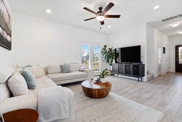 9015 Looksee Ln, Austin, TX 78744 - living room featuring light wood-style flooring, a ceiling fan, baseboards, recessed lighting, and visible vents