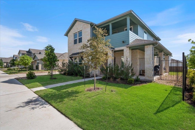 9015 Looksee Ln, Austin, TX 78744 - view of front facade featuring a front lawn, fence, and stone siding