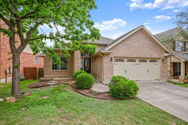 view of front of home with concrete driveway, brick siding, a front lawn, and a garage
