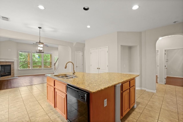 kitchen featuring a sink, black dishwasher, open floor plan, light tile patterned floors, and visible vents