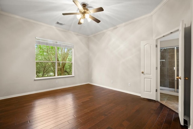 empty room with dark wood-type flooring, a ceiling fan, crown molding, and visible vents