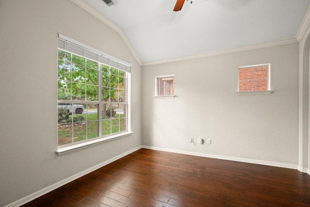empty room with crown molding, baseboards, a ceiling fan, and lofted ceiling