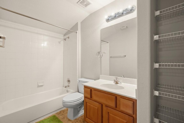full bath featuring visible vents, tile patterned flooring, toilet, lofted ceiling, and tub / shower combination