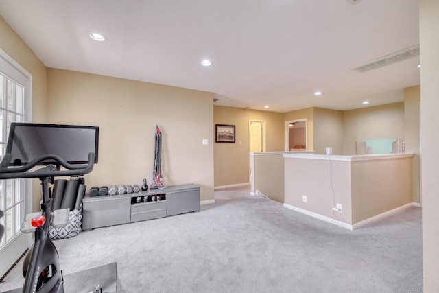 interior space featuring recessed lighting, baseboards, visible vents, and carpet