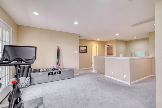 4511 Heights Dr, Austin, TX 78746 - exercise room featuring carpet flooring and recessed lighting