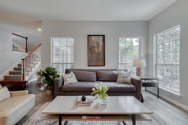 4511 Heights Dr, Austin, TX 78746 - living room featuring light wood-style floors and stairway