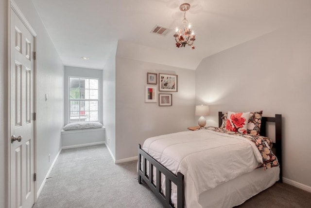 carpeted bedroom with visible vents, baseboards, and a chandelier