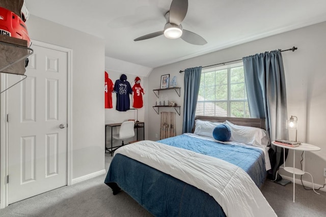 carpeted bedroom with baseboards and a ceiling fan