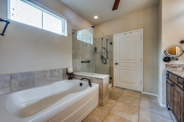 bathroom with a bath, a shower stall, vanity, baseboards, and tile patterned floors