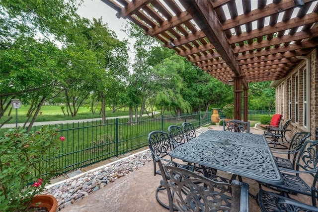 view of patio featuring a fenced backyard, a pergola, and outdoor dining space