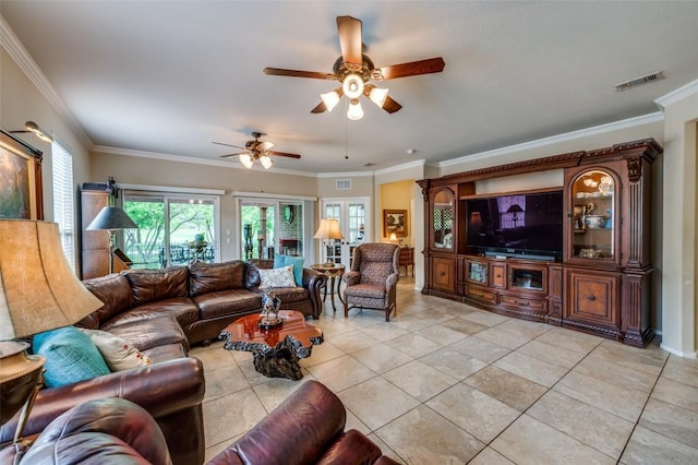 living area with light tile patterned floors, ceiling fan, ornamental molding, and visible vents