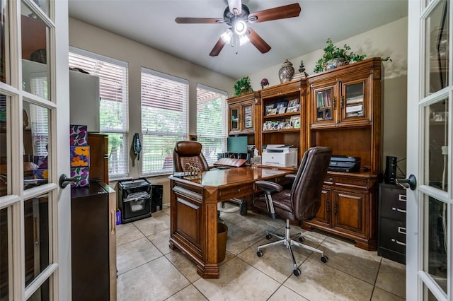 home office featuring ceiling fan and light tile patterned floors