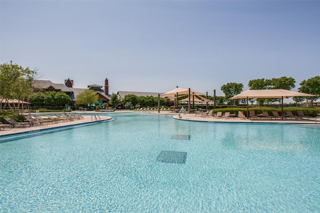 community pool featuring a gazebo and a patio area