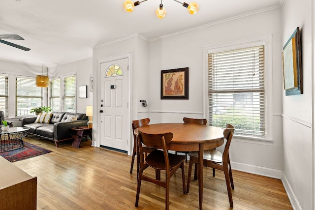 5011 Eilers Ave, Austin, TX 78751 - dining area with crown molding, light wood finished floors, a ceiling fan, and baseboards