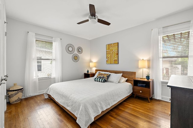 5011 Eilers Ave, Austin, TX 78751 - bedroom with hardwood / wood-style flooring, baseboards, and a ceiling fan