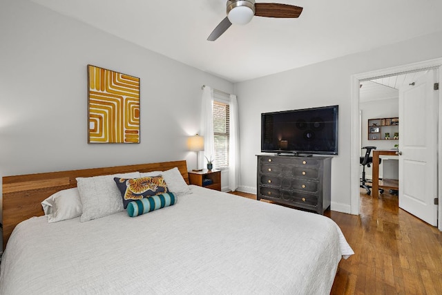 5011 Eilers Ave, Austin, TX 78751 - bedroom featuring wood finished floors, a ceiling fan, baseboards, and an office area