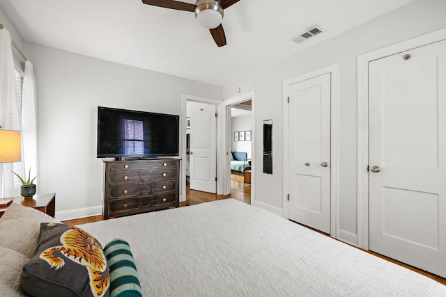 5011 Eilers Ave, Austin, TX 78751 - bedroom featuring baseboards, wood finished floors, and a ceiling fan