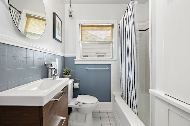 5011 Eilers Ave, Austin, TX 78751 - bathroom with tile patterned flooring, toilet, vanity, and shower / tub combo with curtain