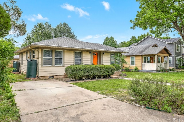 5011 Eilers Ave, Austin, TX 78751 - view of front of property with a front yard, a shingled roof, and a porch