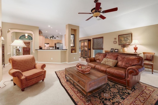 living area with baseboards, ceiling fan, recessed lighting, and light colored carpet