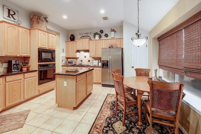 kitchen with decorative backsplash, a kitchen island, dark countertops, black appliances, and light brown cabinets