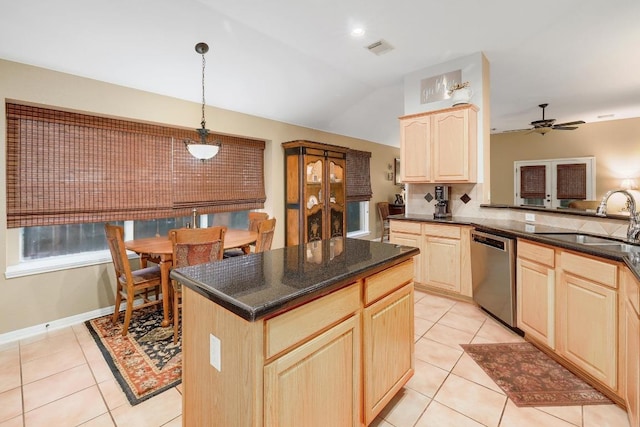 kitchen featuring a sink, light brown cabinetry, visible vents, and dishwasher