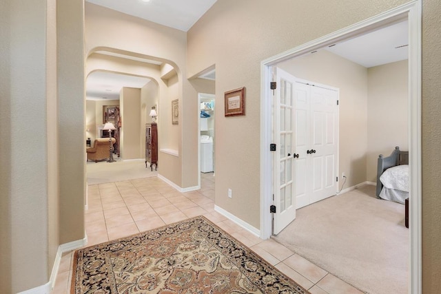corridor featuring light tile patterned floors
