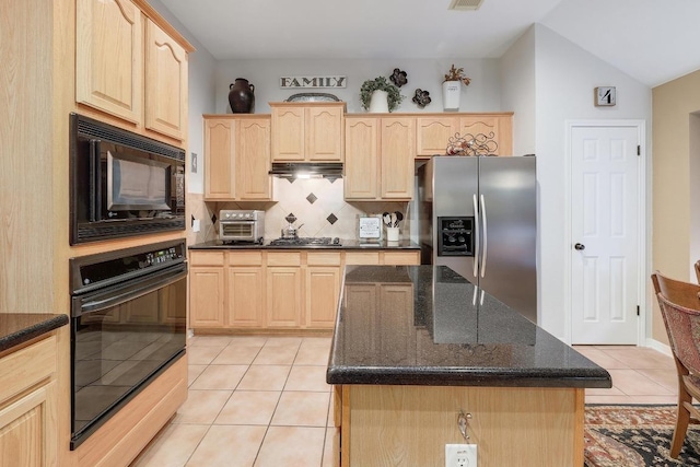 kitchen with light brown cabinets, dark stone countertops, light tile patterned floors, tasteful backsplash, and black appliances