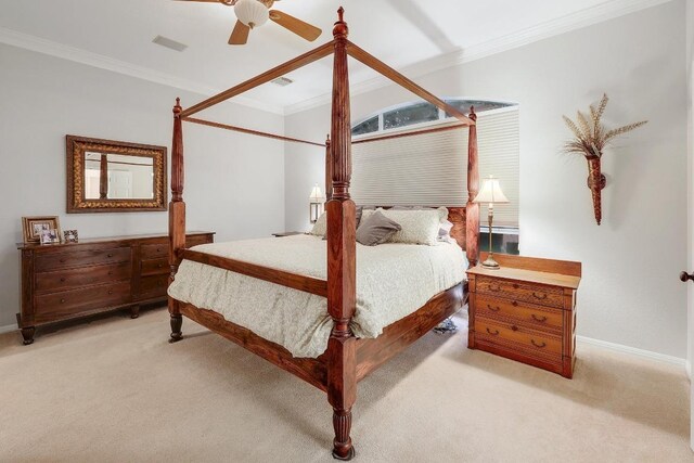 bedroom featuring visible vents, carpet flooring, crown molding, and a ceiling fan