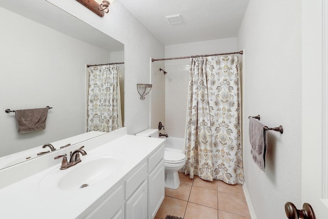 bathroom with visible vents, vanity, shower / bath combination with curtain, toilet, and tile patterned floors
