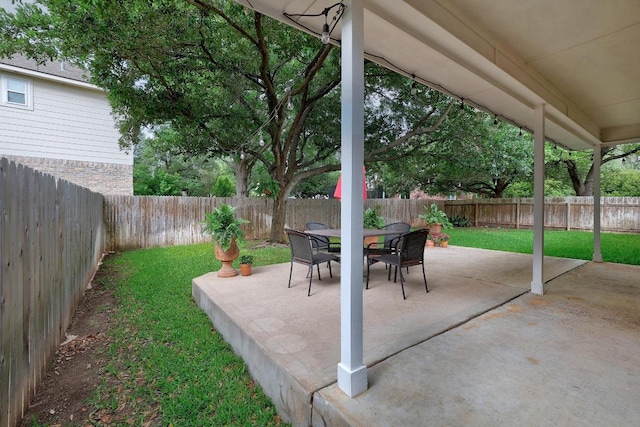 view of patio / terrace featuring outdoor dining area and a fenced backyard