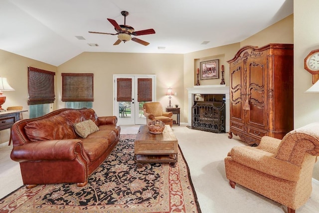 living room featuring carpet flooring, a ceiling fan, and lofted ceiling