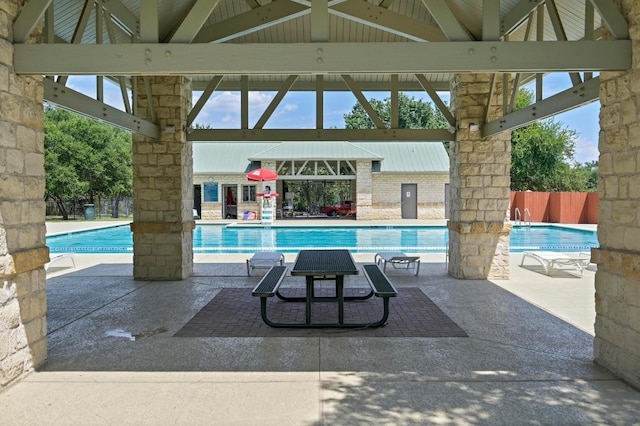 pool featuring a patio and a gazebo