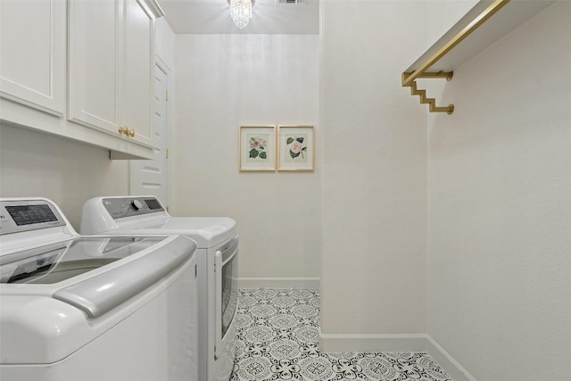 washroom with independent washer and dryer, light tile patterned flooring, baseboards, and cabinet space