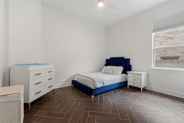 bedroom with baseboards and ceiling fan