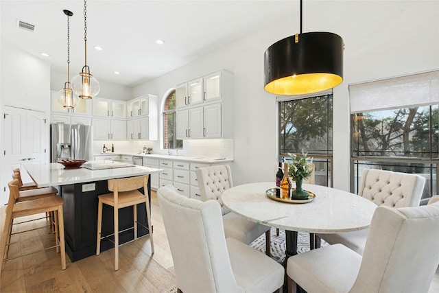 201 Explorer, Lakeway, TX 78734 - dining room with light wood-style floors and recessed lighting
