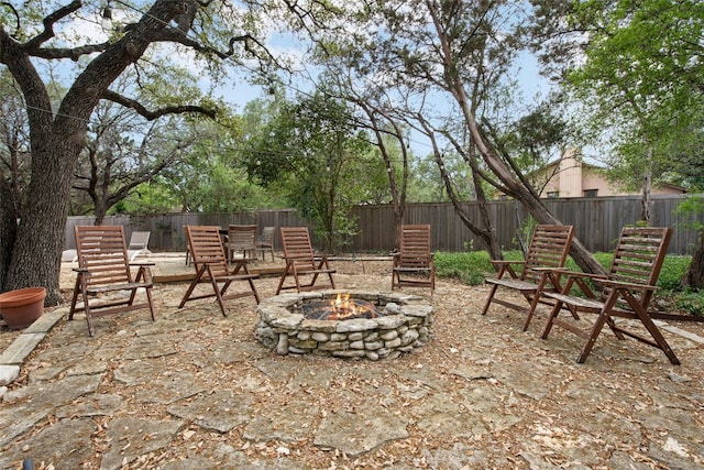 201 Explorer, Lakeway, TX 78734 - fenced backyard featuring a fire pit and a patio area